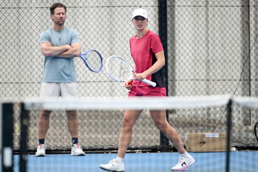 Poland's Iga Swiatek (R) attends a practice session ahead of the United Cup tennis tournament in Sydney on January 2, 2026.  Saeed KHAN / AFP