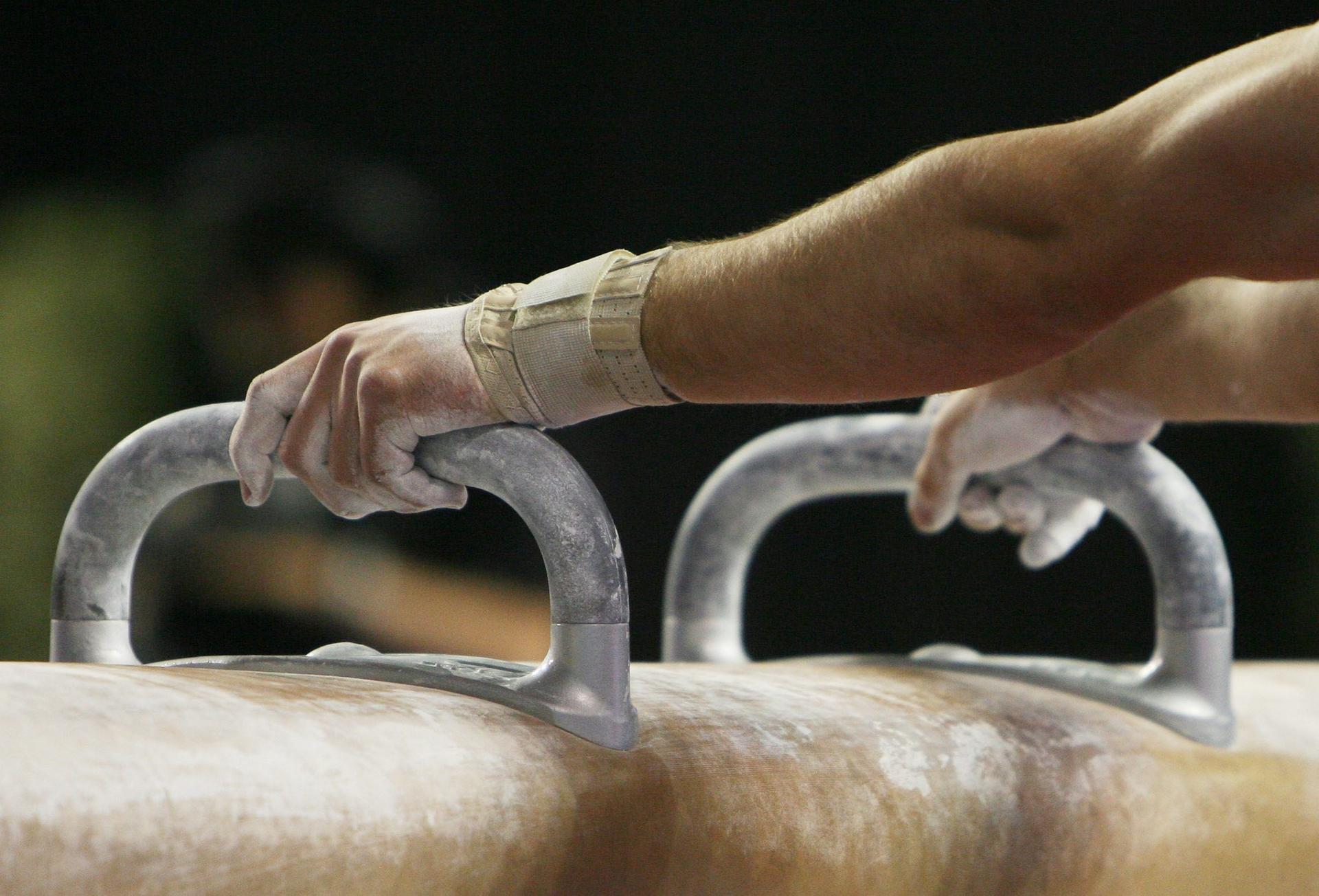 20070513 - GENT, BELGIUM : Illustration picture shows a close up on the hands of an athlete competing the vault men final of the World Cup Gymnastics at Gent's topsporthal, Sunday 13 June 2007, Belgium.  BELGA PHOTO ERIC LALMAND