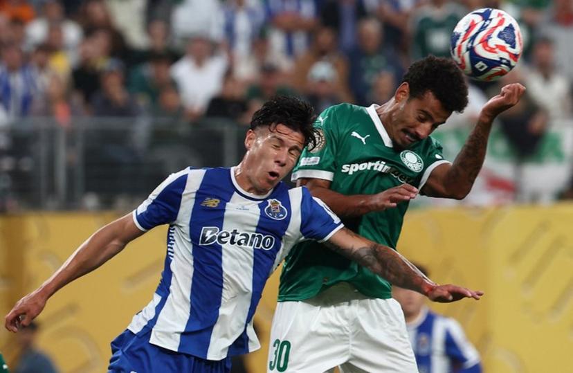 FC Porto's Argentine defender #24 Nehuen Perez and Palmeiras' Brazilian midfielder #30 Lucas Evangelista fight for the ball during the Club World Cup 2025 Group A football match between Brazil's Palmeiras and Portugal's FC Porto at the MetLife stadium East Rutherford, New Jersey on June 15, 2025.  FRANCK FIFE / AFP