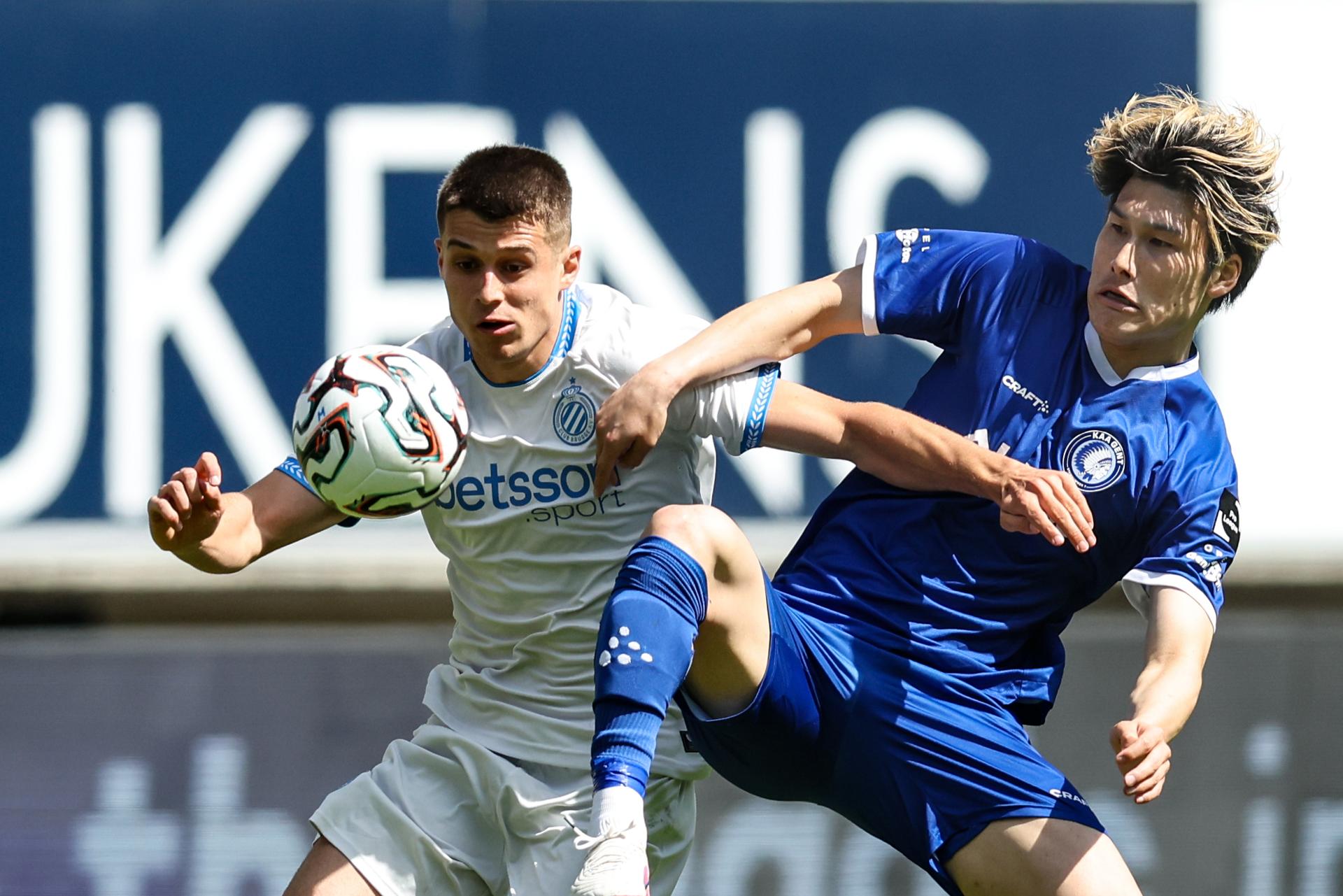 Club's Nicolo Tresoldi and Gent's Daiki Hashioka fight for the ball during a soccer match between KAA Gent and Club Brugge, Sunday 26 April 2026 in Gent, on the fifth day of the Champion's Play-offs of the 2025-2026 'Jupiler Pro League' first division of the Belgian championship. BELGA PHOTO BRUNO FAHY