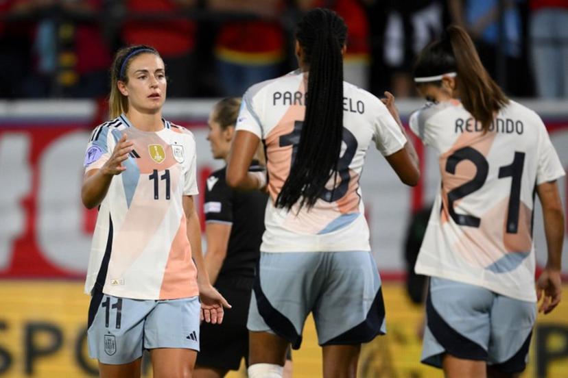 Spanish team players Spain's midfielder #11 Alexia Putellas, Spain's forward #18 Salma Paralluelo and Spain's forward #21 Alba Redondo celebrate their 5-1 win over belgium in the UEFA Women's Nations League group A3 football match between Belgium and Spain at the King Power at Den Dreef Stadium, in Leuven on May 30, 2025.  JOHN THYS / AFP