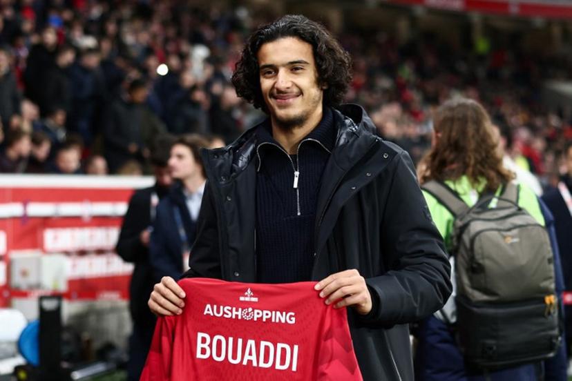 Lille's French midfielder #32 Ayyoub Bouaddi poses for a photograph with a jersey reading "Bouaddi 2029" after his contract's extension with Lille ahead of the French L1 football match between Lille LOSC and Olympique de Marseille (OM) at the Pierre-Mauroy stadium in Villeneuve-d'Ascq, northern France, on December 5, 2025.  Sameer Al-Doumy / AFP