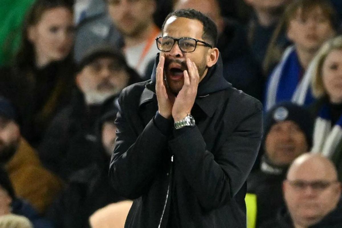 Chelsea's English head coach Liam Rosenior gestures on the touchline during the English Premier League football match between Brighton and Hove Albion and Chelsea at the American Express Community Stadium in Brighton, southern England on April 21, 2026.  Glyn KIRK / AFP