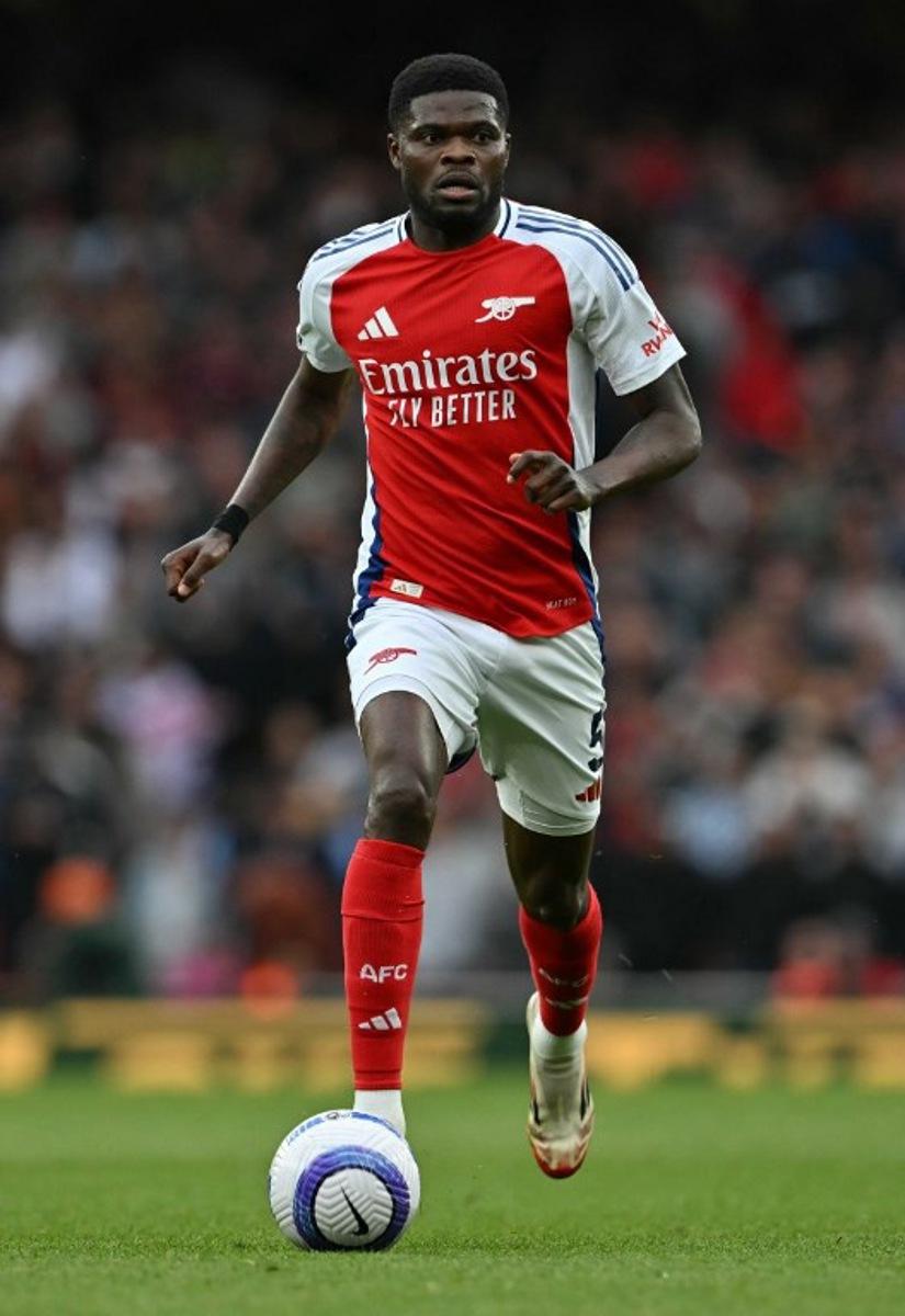 Arsenal's Ghanaian midfielder #05 Thomas Partey runs with the ball during the English Premier League football match between Arsenal and Bournemouth at the Emirates Stadium in London on May 3, 2025.   Glyn KIRK / AFP