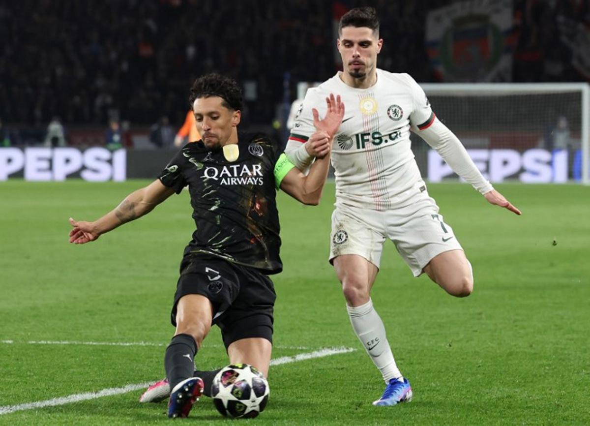 Paris Saint-Germain's Brazilian defender #05 Marquinhos (L) defends against Chelsea's Portuguese forward #07 Pedro Neto during the UEFA Champions League round of 16 first leg football match between Paris Saint-Germain (PSG) and Chelsea at the Parc des Princes stadium in Paris on March 11, 2026.  Alain JOCARD / AFP