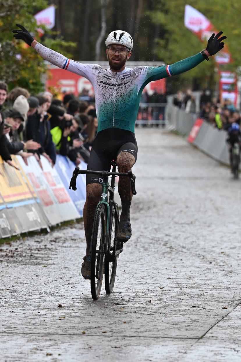 Dutch Joris Nieuwenhuis celebrates as he crosses the finish line to win the elite men's race of the Exact Cross, stage 3 (out of 7) in the Exact Cross cyclocross competition, in Heerde, on Saturday 25 October 2025. BELGA PHOTO DAVID PINTENS