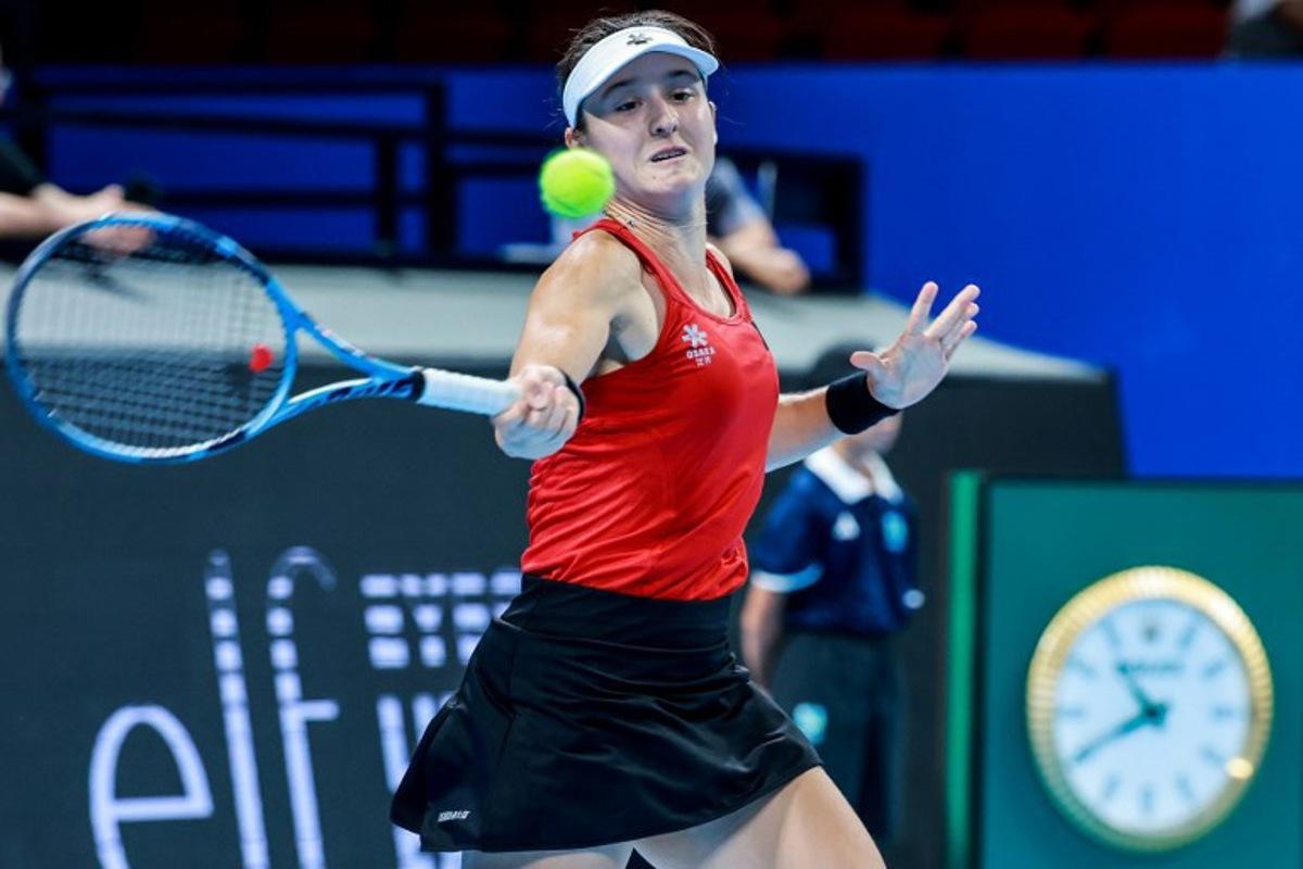 Belgium's Jana Otzipka hits a return to Ukraina's Anhelina Kalinina during their women's singles quarter-final match at the Billie Jean King Cup tennis tournament in Shenzhen, southern China's Guangdong province on September 24, 2026.  CN-STR / AFP