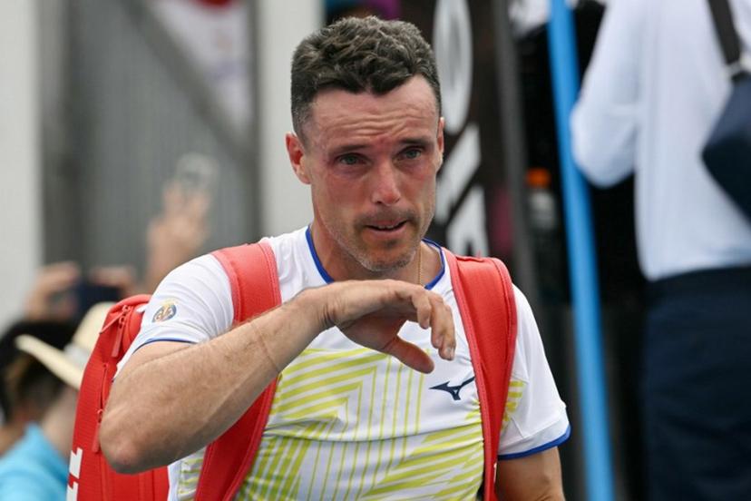 Spain's Roberto Bautista Agut leaves the court after his defeat against China's Shang Juncheng in their men's singles match on day two of the Australian Open tennis tournament in Melbourne on January 19, 2026.  Paul Crock / AFP