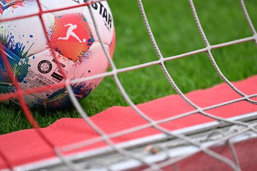 An official Derbystar matchball for the Bundesliga is pictured in the net prior to the German first division Bundesliga football match between 1 FSV Mainz 05 and Borussia Dortmund in Mainz, western Germany on September 27, 2025.  Kirill KUDRYAVTSEV / AFP