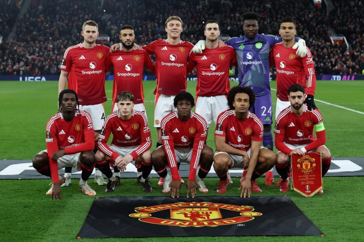 Manchester United's Cameroonian goalkeeper #24 Andre Onana, Manchester United's Moroccan defender #03 Noussair Mazraoui, Manchester United's Dutch defender #04 Matthijs de Ligt, Manchester United's English defender #26 Ayden Heaven, Manchester United's Portuguese defender #20 Diogo Dalot, Manchester United's Brazilian midfielder #18 Casemiro, Manchester United's Portuguese midfielder #08 Bruno Fernandes, Manchester United's Danish defender #13 Patrick Dorgu, Manchester United's Argentinian midfielder #17 Alejandro Garnacho, Manchester United's Danish striker #09 Rasmus Hojlund and Manchester United's Dutch striker #11 Joshua Zirkzee  pose for a team photo ahead of the UEFA Europa League Last 16 Second Leg football match between Manchester United and Real Sociedad at Old Trafford stadium in Manchester, north west England, on March 13, 2025.  Darren Staples / AFP