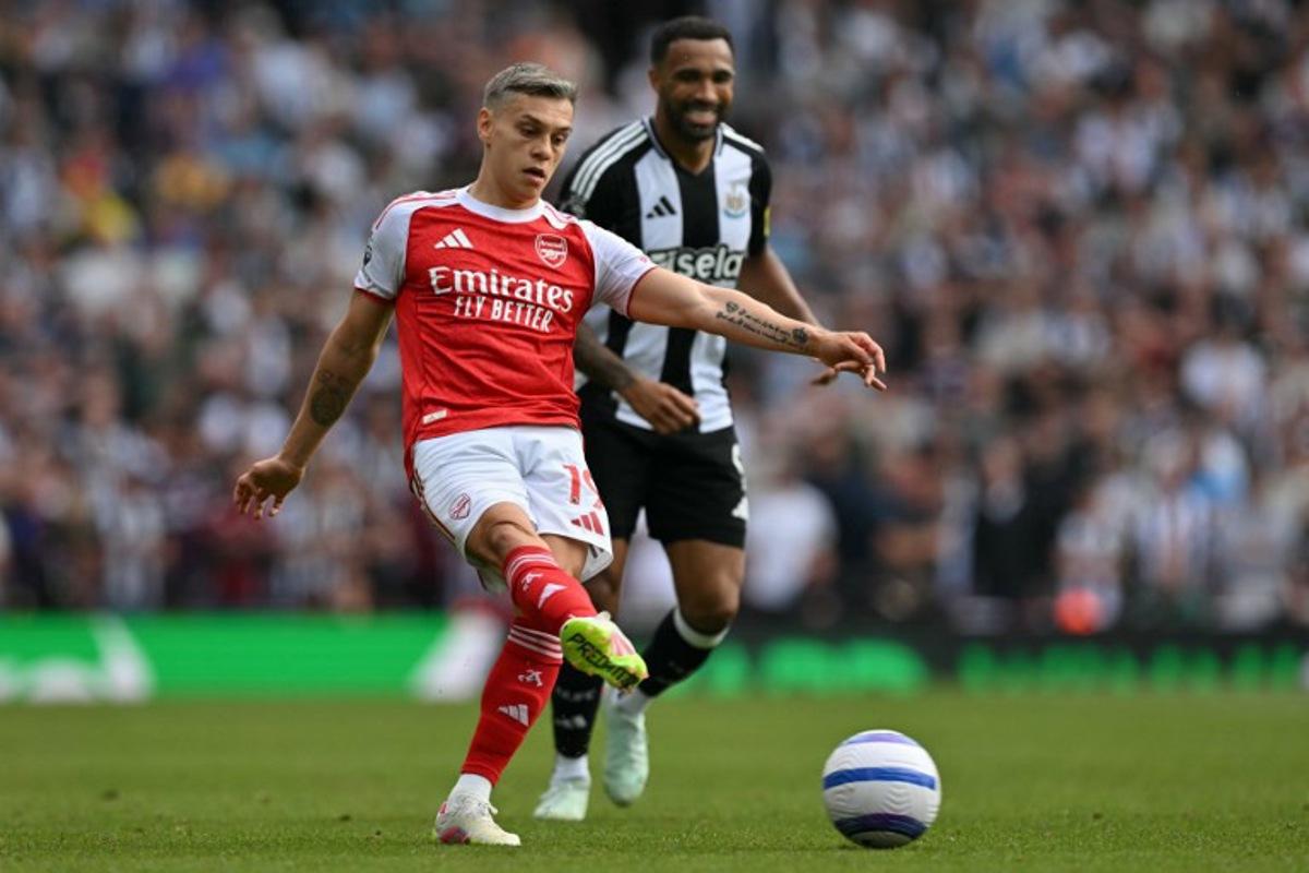 Arsenal's Belgian midfielder #19 Leandro Trossard passes the ball during the English Premier League football match between Arsenal and Newcastle United at the Emirates Stadium in London on May 18, 2025.   Glyn KIRK / AFP