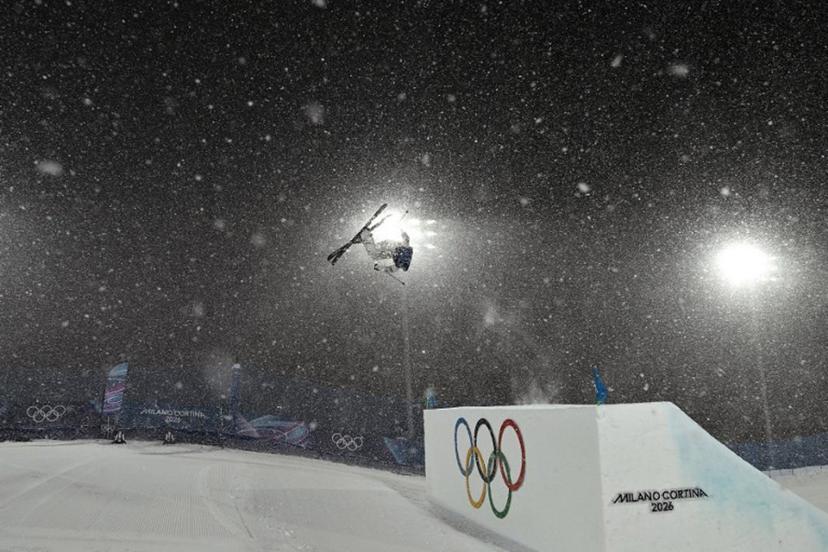 China's Gu Ailing Eileen warms up in heavy snowfall prior to the freestyle skiing women's freeski big air final run 1 during the Milano Cortina 2026 Winter Olympic Games at Livigno Snow Park, in Livigno (Valtellina), on February 16, 2026.  Jeff PACHOUD / AFP