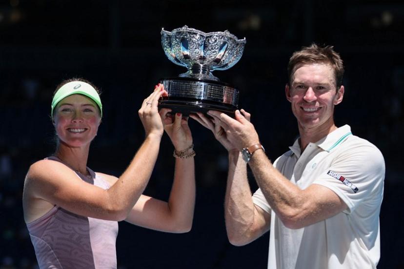 Australia's Olivia Gadecki and John Peers pose with the trophy after victory against France's Kristina Mladenovic and Manuel Guinard during their mixed doubles final match on day thirteen of the Australian Open tennis tournament in Melbourne on January 30, 2026.   Martin KEEP / AFP