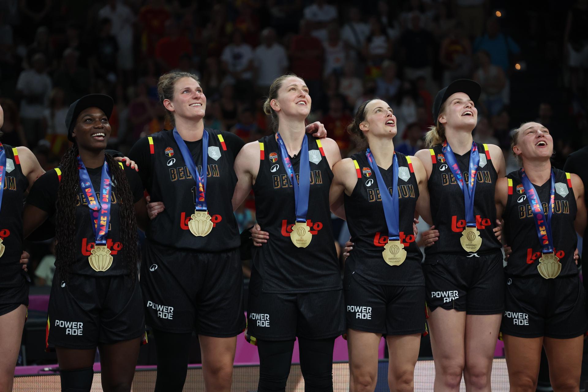 Belgium's Kyara Linskens, Belgium's Emma Meesseman, Belgium's Antonia Delaere and Belgium's Nastja Claessens celebrate after winning a basketball match between Spain and Belgian national team 'the Belgian Cats' on Sunday 29 June 2025 in Piraeus, Greece, the final of the FIBA Women's EuroBasket 2025.  BELGA PHOTO VIRGINIE LEFOUR