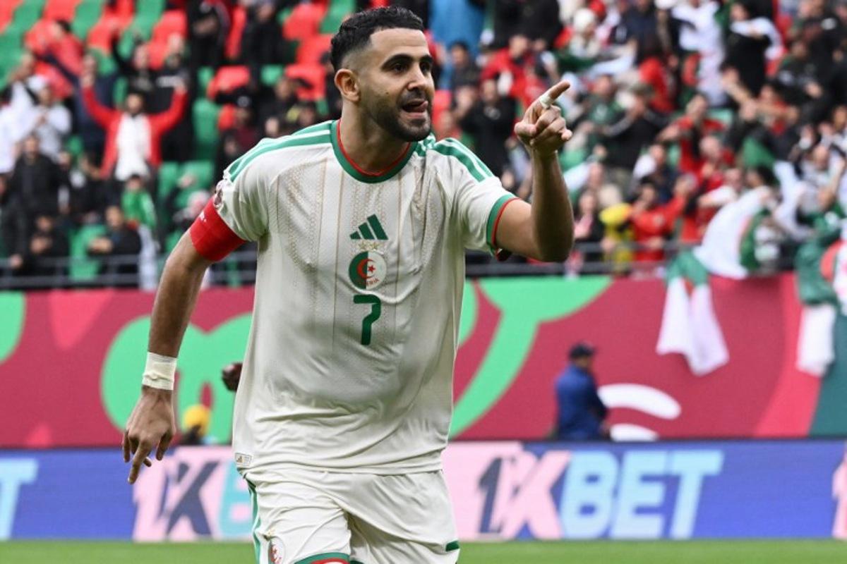 Algeria's forward #7 Riyad Mahrez celebrates scoring the team's first goal during the Africa Cup of Nations (CAN) Group E football match between Algeria and Sudan at Moulay Hassan Stadium in Rabat on December 24, 2025.   SEBASTIEN BOZON / AFP