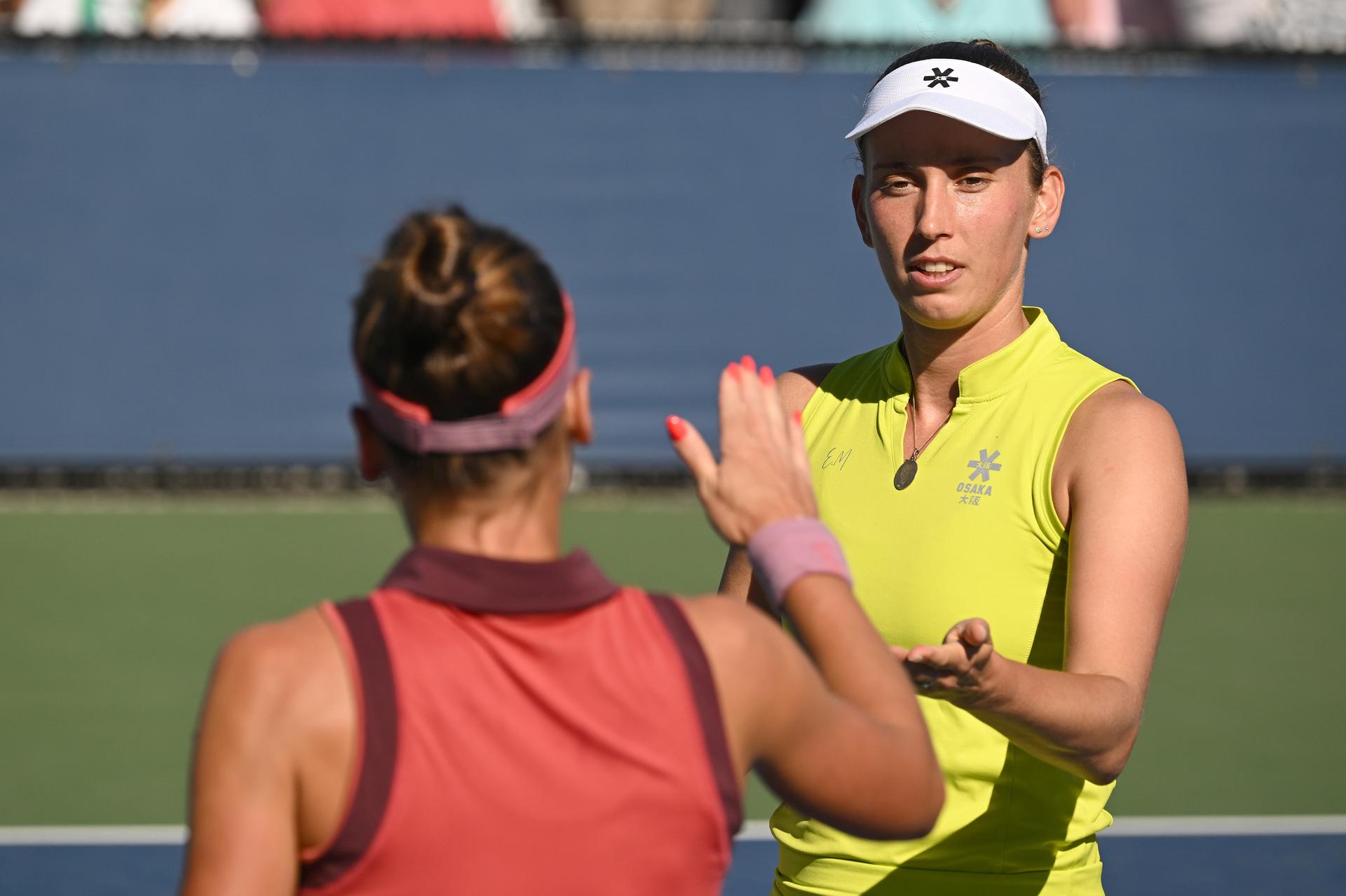 Belgian Elise Mertens (yellow) and Veronika Kudermetova (pink) pictured during a tennis match against US pair Brantmeier-Hamilton, in the second round of the women's doubles of the 2025 US Open Grand Slam tennis tournament in New York City, USA, Saturday 30 August 2025. BELGA PHOTO TONY BEHAR