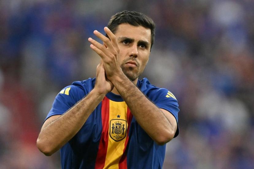 Spain's midfielder #16 Rodri greets fans during warm ups ahead of the UEFA Euro 2024 semi-final football match between Spain and France at the Munich Football Arena in Munich on July 9, 2024.  MIGUEL MEDINA / AFP