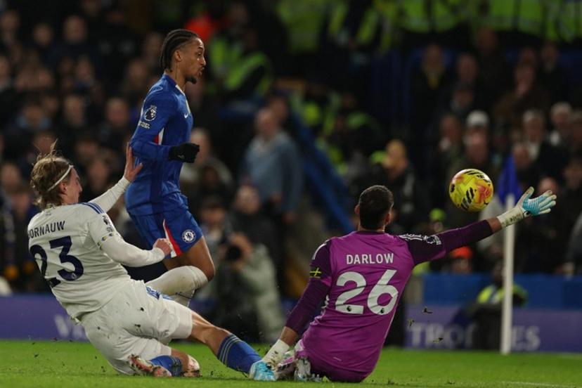 Chelsea's Brazilian striker #20 Joao Pedro (2L) shoots to score the opening goal of the English Premier League football match between Chelsea and Leeds United at Stamford Bridge in London on February 10, 2026.  Adrian Dennis / AFP