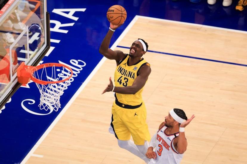 Indiana Pacers' power forward #43 Pascal Siakam jumps to shoot past Knicks' shooting guard #03 Josh Hart during Game Five of the Eastern Conference Finals of the 2025 NBA Playoffs between the New York Knicks and the Indiana Pacers at Madison Square Garden in New York on May 29, 2025.  CHARLY TRIBALLEAU / AFP