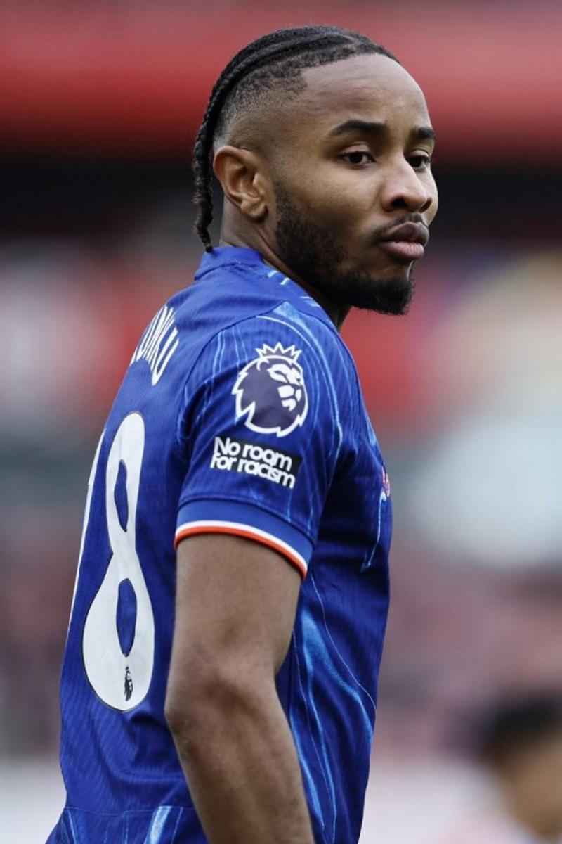 Chelsea's French striker #18 Christopher Nkunku looks on during the English Premier League football match between Arsenal and Chelsea at the Emirates Stadium in London on March 16, 2025.   BENJAMIN CREMEL / AFP