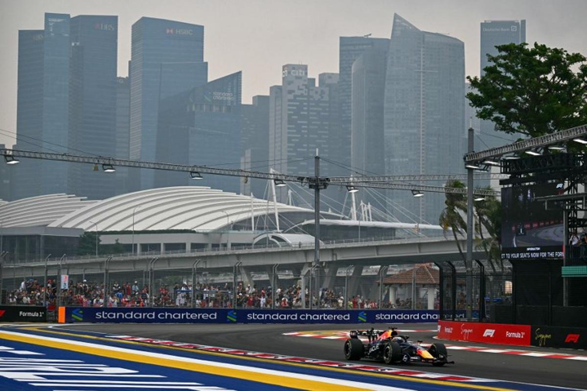 Red Bull Racing's Dutch driver Max Verstappen warms-up before the start of the sprint race ahead of the Formula One Singapore Grand Prix at the Marina Bay Street Circuit in Singapore on October 10, 2026.  Lillian SUWANRUMPHA / AFP