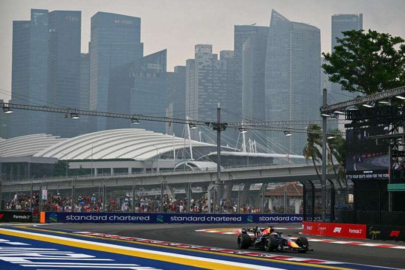 Red Bull Racing's Dutch driver Max Verstappen warms-up before the start of the sprint race ahead of the Formula One Singapore Grand Prix at the Marina Bay Street Circuit in Singapore on October 10, 2026.  Lillian SUWANRUMPHA / AFP