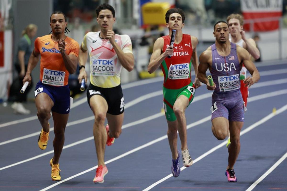 Netherlands' Eugene Omalla (L), Belgium's Jonathan Sacoor, Portugal's Pedro Afonso and USA's Justin Robinson compete in the men's final 4x400 metres relay event during the World Athletics Indoor Championships Kujawy Pomorze 2026 in Torun, Poland on March 22, 2026.  Wojtek RADWANSKI / AFP