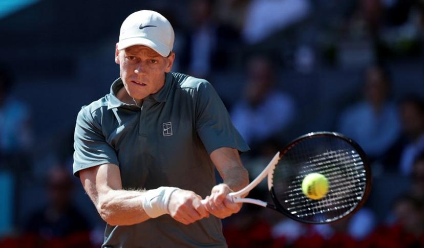 Italy's Jannik Sinner returns the ball to Denmark's Elmer Moller during their 2026 ATP Tour Madrid Open tennis tournament third round singles match at the Caja Magica in Madrid, on April 26, 2026.   Thomas COEX / AFP