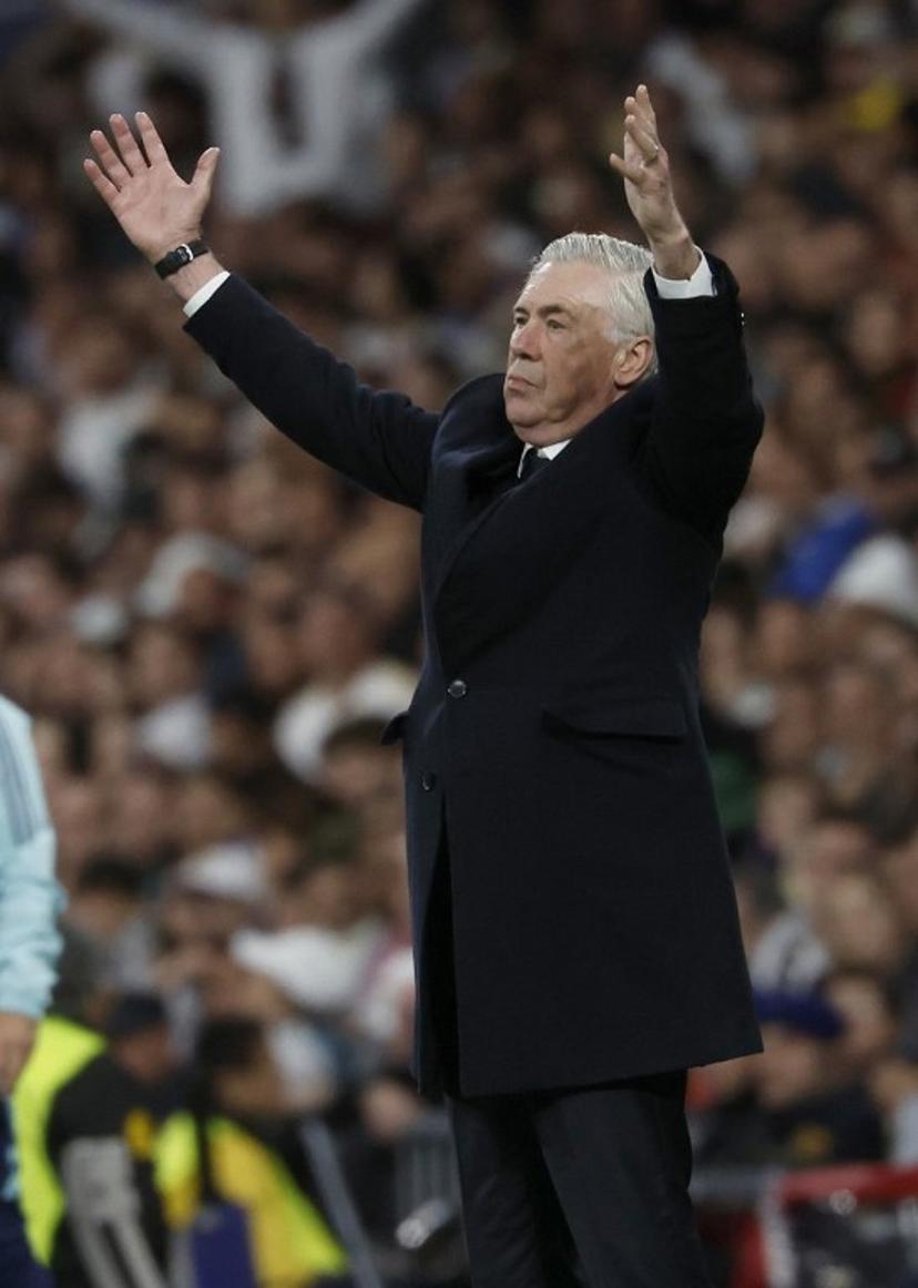 Real Madrid's Italian coach Carlo Ancelotti gestures on the touchline during the UEFA Champions League quarter final second leg football match between Real Madrid CF and Arsenal at Santiago Bernabeu Stadium in Madrid on April 16, 2025.  Pierre-Philippe MARCOU / AFP