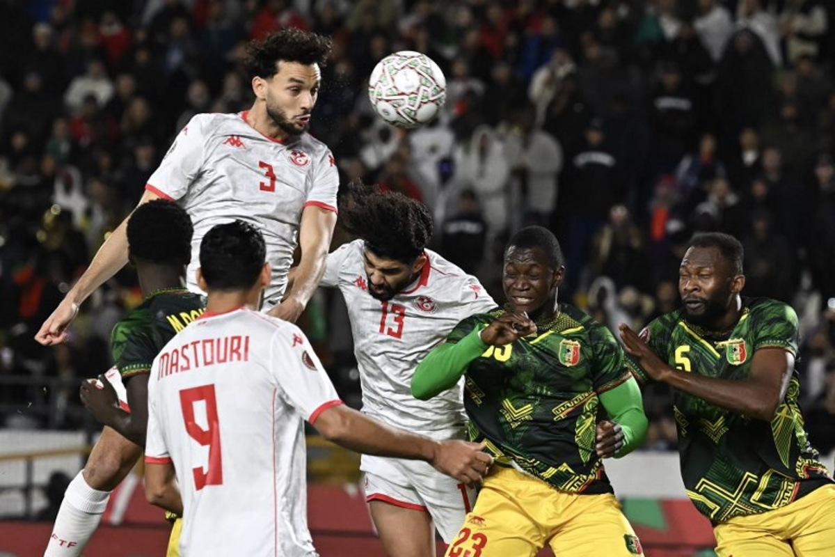 Tunisia's defender #03 Montassar Omar Talbi (2 L) heads the ball during the Africa Cup of Nations (CAN) round of 16 football match between Mali and Tunisia at Mohammed V Stadium in Casablanca on January 3, 2026.  Paul ELLIS / AFP