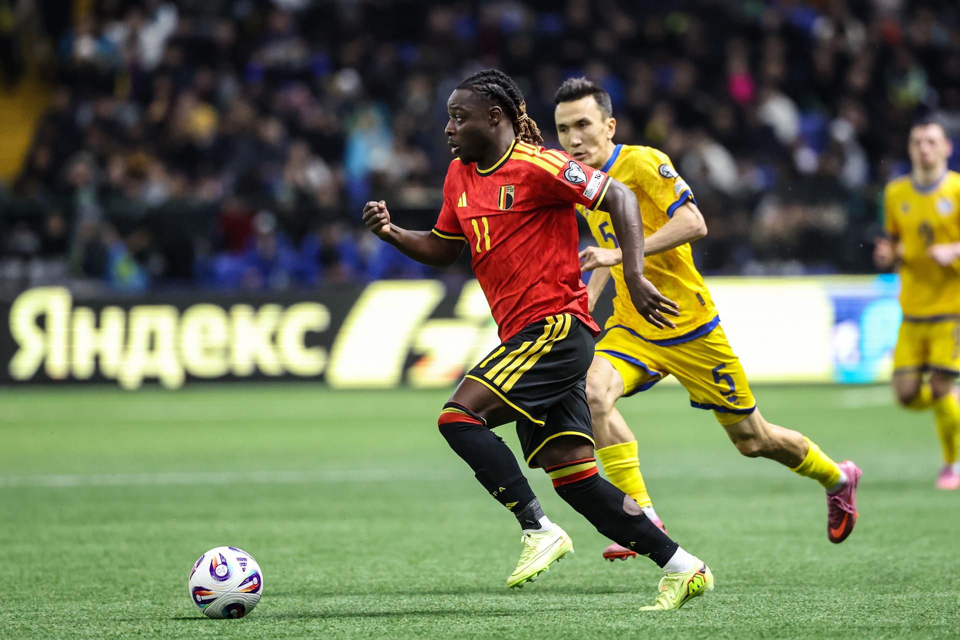 Belgium's Jeremy Doku and Kazakhstan Bagdat Kairov fight for the ball during a soccer game between Kazakhstan and Belgium's Red Devils, Saturday 15 November 2025 in Astana, Kazakhstan, qualification game 7/8 for the 2026 FIFA World Cup. BELGA PHOTO VIRGINIE LEFOUR