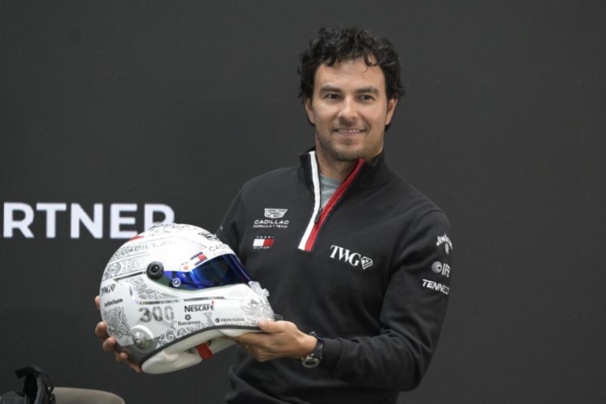 Mexican F1 driver Sergio Perez of Cadillac Team shows his helmet during a press conference in Mexico City, on October 27, 2026, ahead of the upcoming Mexico GP.  Alfredo ESTRELLA / AFP
