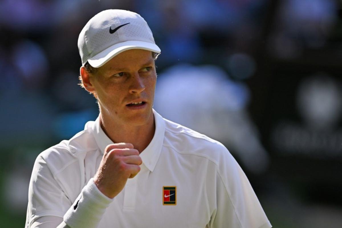 Italy's Jannik Sinner celebrates winning the second set against Serbia's Novak Djokovic during their men's singles semi-final tennis match on the twelfth day of the 2025 Wimbledon Championships at The All England Lawn Tennis and Croquet Club in Wimbledon, southwest London, on July 11, 2025.  Glyn KIRK / AFP
