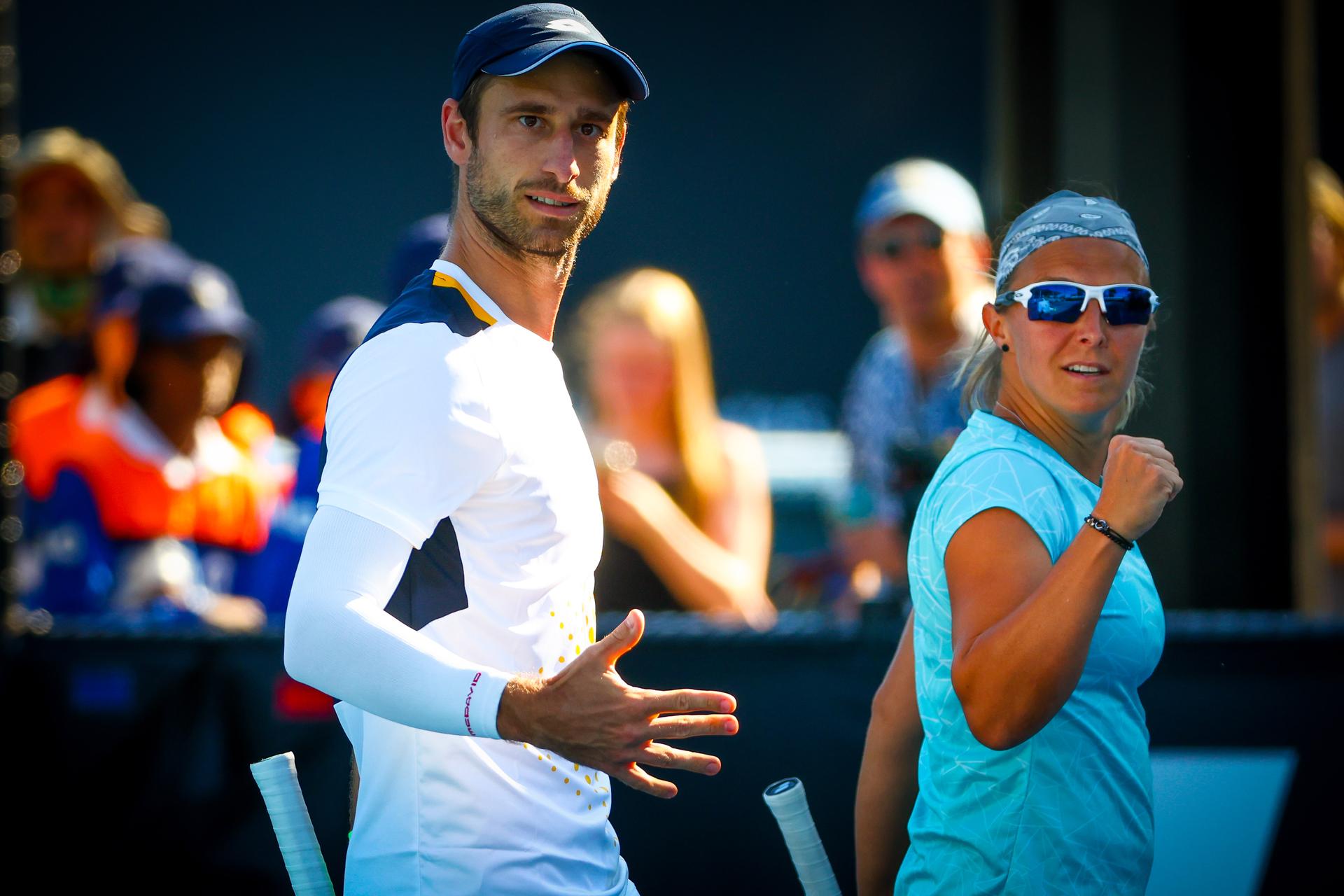 Belgian Kirsten Flipkens and Belgian Sander Gille pictured in action during a tennis match between the Belgian pair Flipkens-Gille and French-Croatian pair Mladenovic-Dodig, in the first round of the mixed doubles at the 'Australian Open' Grand Slam tennis tournament, Saturday 22 January 2022 in Melbourne Park, Melbourne, Australia. The 2022 edition of the Australian Grand Slam takes place from January 17th to January 30th. BELGA PHOTO PATRICK HAMILTON
