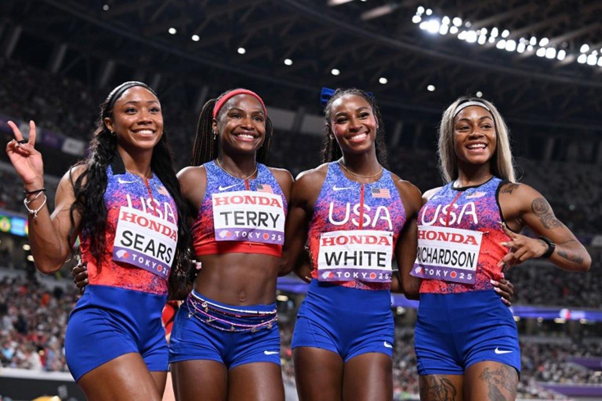 (From L) US' athlete Jacious Sears, US' Twanisha Terry, US' athlete Kayla White and US' Sha'carri Richardson pose after the women's 4x100m relay heats during the World Athletics Championships in Tokyo on September 20, 2025.  Jewel SAMAD / AFP