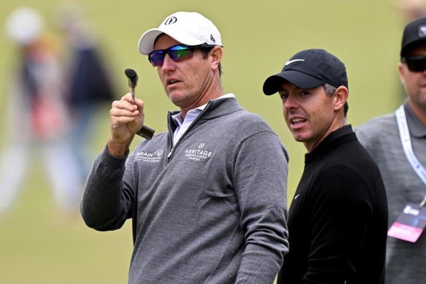 Nicolas Colsaerts of Belgium (L) chats with Northern Ireland's Rory McIlroy (R) during a practice round ahead of the Australian Open golf tournament at the Royal Melbourne Golf Club in Melbourne on December 2, 2025.  William WEST / AFP