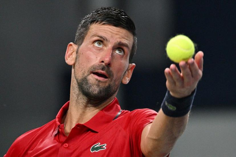 Serbia's Novak Djokovic serves to Monaco's Valentin Vacherot during their men's singles semi-final match at the Shanghai Masters tennis tournament in Shanghai on October 11, 2025.  Hector RETAMAL / AFP
