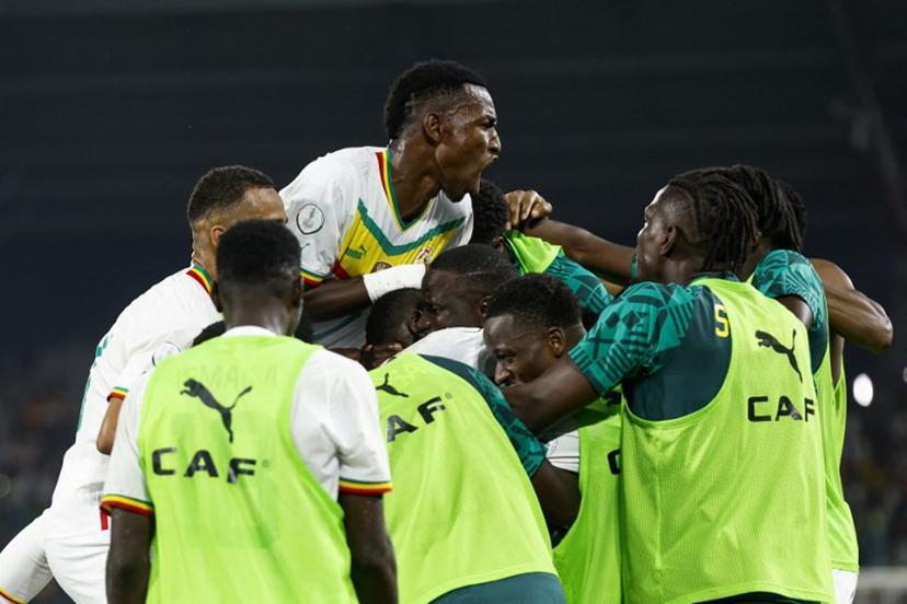 Senegal's forward #7 Nicolas Jackson (C) celebrates with teammates their third goal during the Africa Cup of Nations (CAN) 2024 group C football match between Senegal and Cameroon at the Stade Charles Konan Banny in Yamoussoukro on January 19, 2024.  KENZO TRIBOUILLARD / AFP