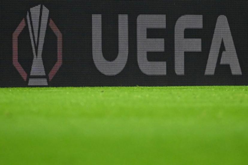 The European Cup logo and the UEFA lettering are visible on an LED wall during the UEFA Europa League first round - day 1 football match between SC Freiburg and FC Basel in Freiburg, southwestern Germany on September 24, 2025.  Silas STEIN / AFP