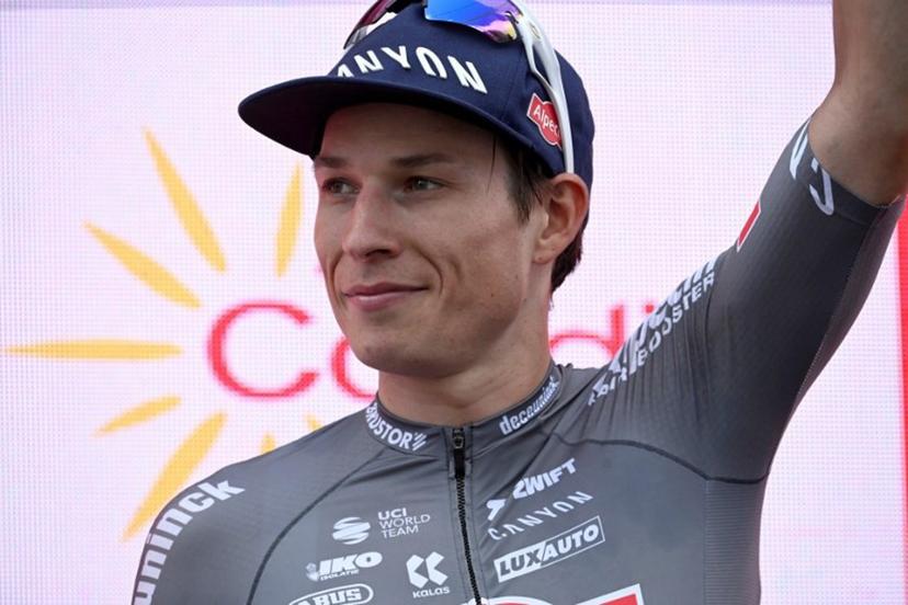 Stage winner team Alpecin's Belgian rider Jasper Philipsen celebrates on the podium after the 19th stage of the Vuelta a Espana, a 159 km race between Rueda and Guijuelo, on September 12, 2025.    Miguel RIOPA / AFP