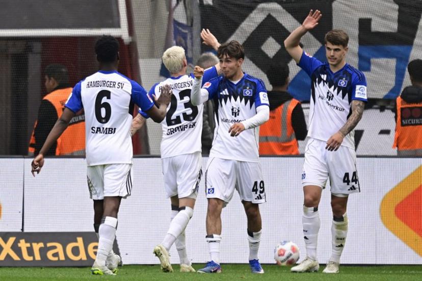 Hamburg's Belgian-Congolese midfielder #06 Albert Sambi Lokonga, Hamburg's Danish midfielder #23 Albert Gronbaek, Hamburg's German forward #49 Otto Stange and Hamburg's Croatian defender #44 Luka Vuskovic celebrate after scoring the opening goal during the German first division Bundesliga football match between Bayer Leverkusen and Hamburger SV (HSV) in Leverkusen, western Germany, on May 16, 2026.  INA FASSBENDER / AFP