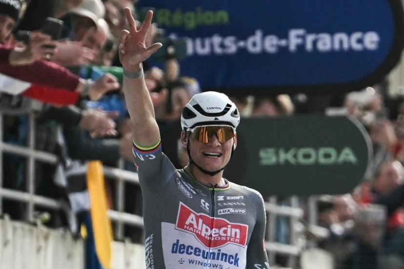 Alpecin-Deceuninck's Dutch rider Mathieu van der Poel gestures representing the number three as he celebrates after crossing the finish line to win the 122nd edition of the Paris-Roubaix one-day classic cycling race, 259,2 km between Compiegne and Roubaix, at the Vélodrome André-Pétrieux in Roubaix, northern France on April 13, 2025. Mathieu van der Poel won cycling's Paris-Roubaix for a third straight time on April 13, 2025 edging Tour de France champion Pogacar in the race nick-named 'The Hell of the North'. Jeff PACHOUD / AFP