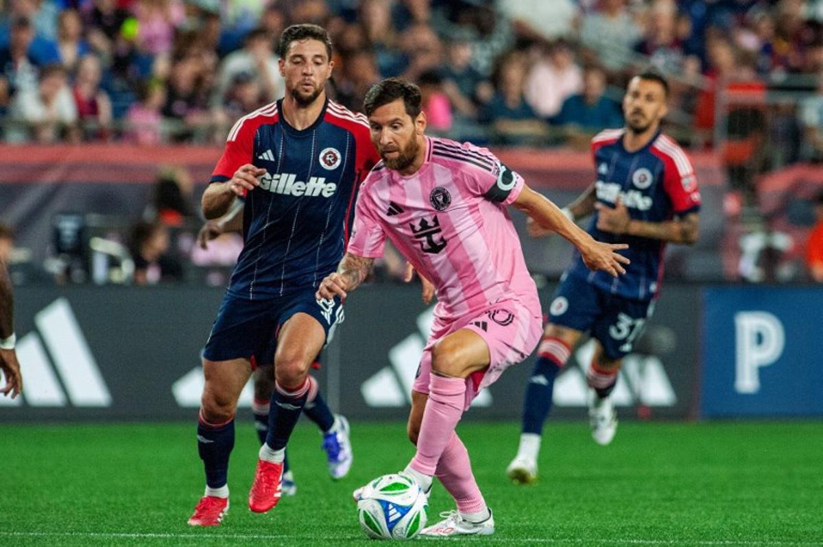 Inter Miami's Argentine forward #10 Lionel Messi runs with the ball next to New England's US midfielder #08 Matt Polster during the Major League Soccer (MLS) regular season match between New England Revolution and Inter Miami CF at Gillette Stadium in Foxborough, Massachusetts on July 9, 2025.  Joseph Prezioso / AFP