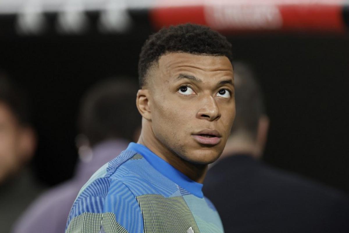 Real Madrid's French forward #10 Kylian Mbappe looks upwards before the Spanish league football match between Real Madrid CF and Club Atletico de Madrid at Santiago Bernabeu Stadium in Madrid on March 22, 2026.  Oscar DEL POZO / AFP