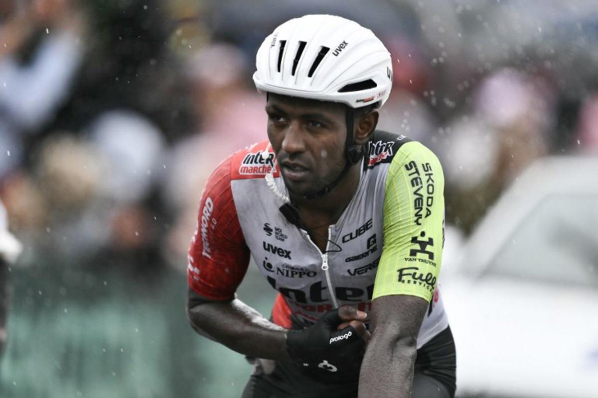 Intermarche - Wanty team's Eritrean rider Biniam Girmay crosses the finish line nursing injuries after a mass crash in the final metres of the 17th stage of the 112th edition of the Tour de France cycling race, 160.4 km between Bollene and Valence, southern France, on July 23, 2025.  Marco BERTORELLO / AFP