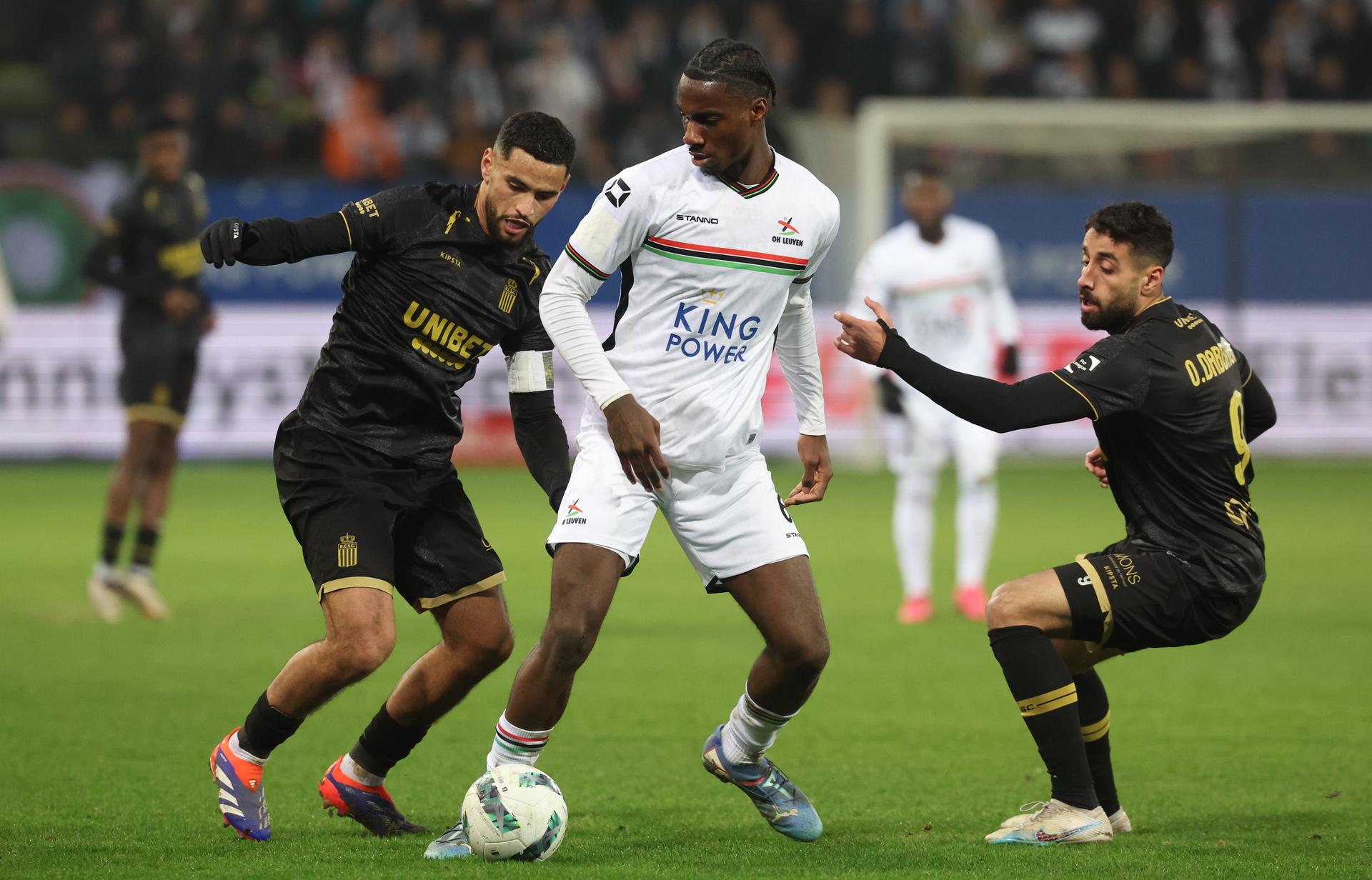 Charleroi's Adem Zorgane and OHL's Ezechiel Banzuzi fight for the ball during a soccer match between Oud-Heverlee Leuven and Sporting Charleroi, Saturday 14 December 2024 in Leuven, on day 18 of the 2024-2025 season of the 'Jupiler Pro League' first division of the Belgian championship. BELGA PHOTO VIRGINIE LEFOUR