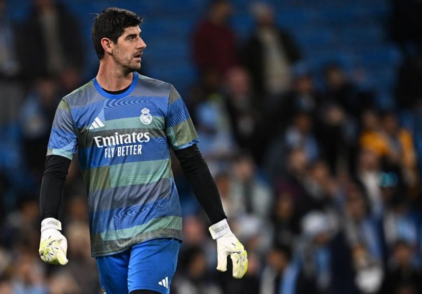 Real Madrid's Belgian goalkeeper #01 Thibaut Courtois warms up ahead of the UEFA Champions League, round of 16 second leg football match between Manchester City and Real Madrid at the Etihad Stadium in Manchester, north west England, on March 17, 2026.  Paul ELLIS / AFP