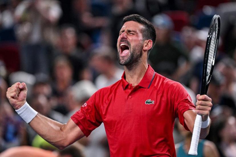 Serbia's Novak Djokovic celebrates after winning against Germany's Yannick Hanfmann during their men's singles match at the Shanghai Masters tennis tournament in Shanghai on October 5, 2025.  Hector RETAMAL / AFP