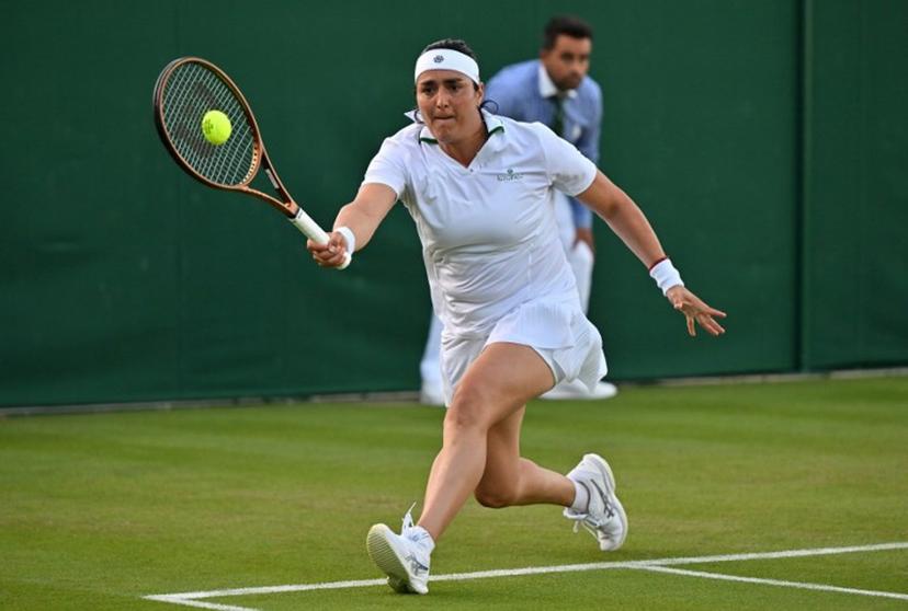 Tunisia's Ons Jabeur returns against Japan's Moyuka Uchijima during their women's singles tennis match on the second day of the 2024 Wimbledon Championships at The All England Lawn Tennis and Croquet Club in Wimbledon, southwest London, on July 2, 2024. Jabeur won the match 6-3, 6-1. Glyn KIRK / AFP