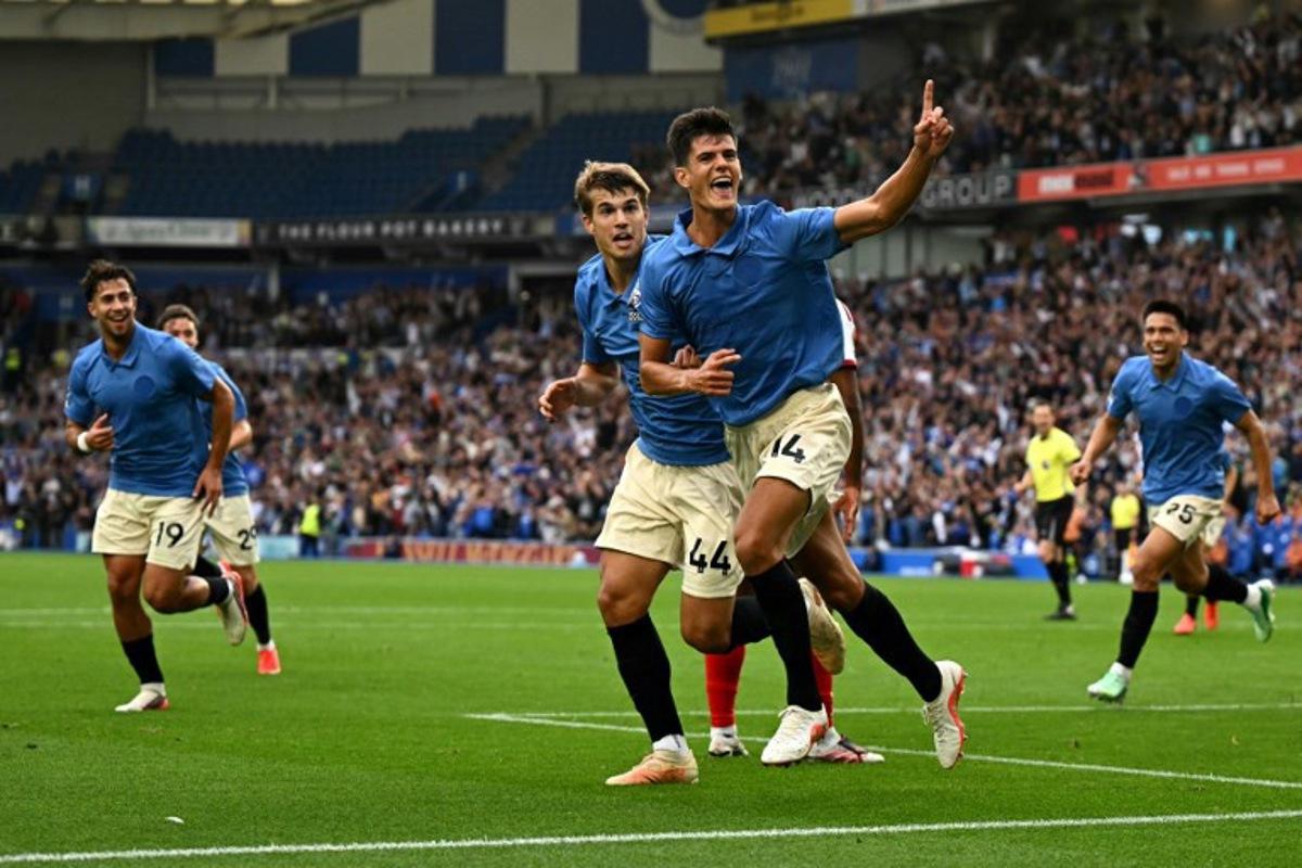 Brighton's Spanish midfielder #14 Chema Andrés celebrates scoring the team's third goal during the English Premier League football match between Brighton and Hove Albion and Arsenal at the American Express Community Stadium in Brighton, southern England on September 19, 2026.  Glyn KIRK / AFP